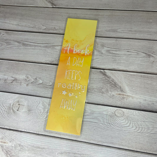 Yellow Bookmark - A Book A Day Keeps Reality Away